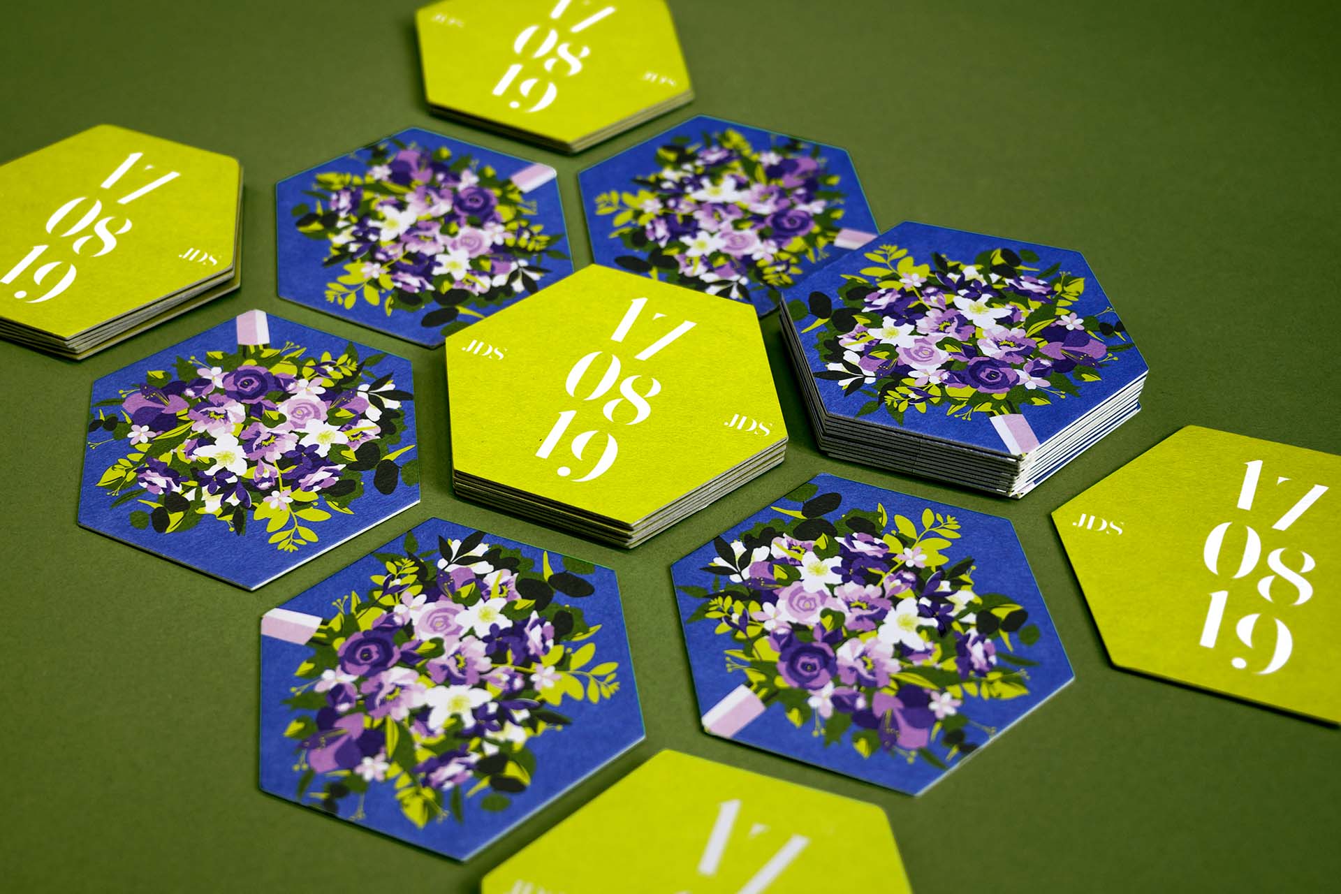 coasters with a date in stencil font and an illustration of a wedding bouquet