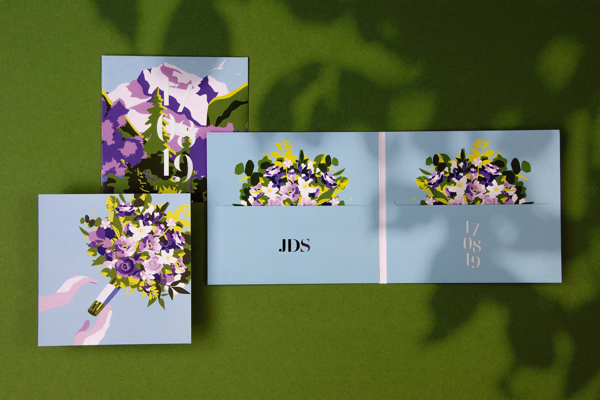 different parts of a wedding invitation with a booklet, CD-case and illustrations