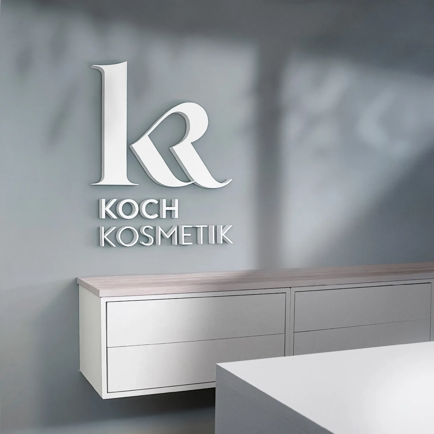 3D logo on wall in the cosmetics studio of Koch Kosmetik